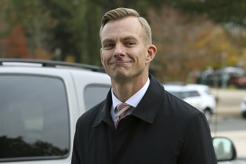 David Holmes, a career diplomat and the political counselor at the embassy in Kyiv, arrives on Capitol Hill, Friday, Nov. 15, 2019, in Washington, to testify before congressional lawmakers as part of the House impeachment inquiry into President Donald Trump. (AP Photo/Jose Luis Magana)