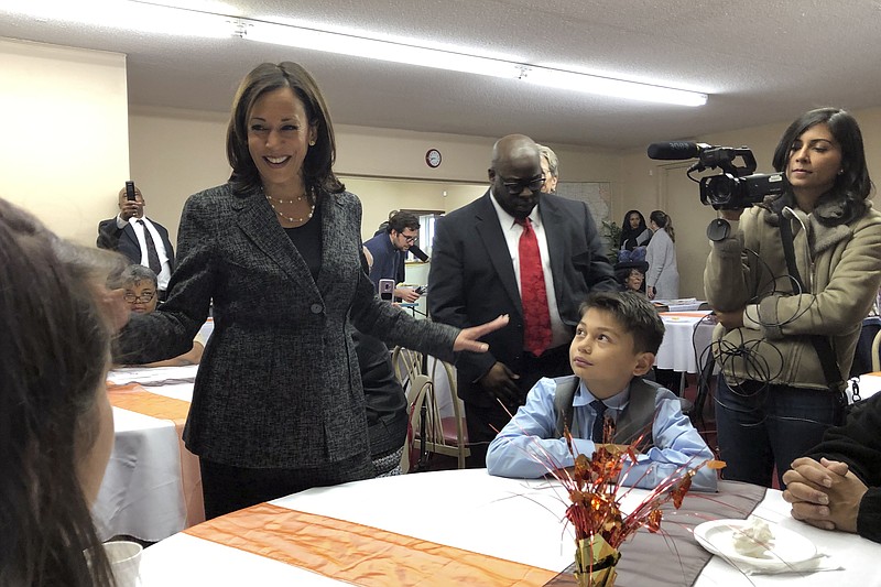 Democratic presidential candidate Sen. Kamala Harris, D-Calif., speaks to Aaron Nachampassak, 11, right and others at a church congregation breakfast in Fort Dodge, Iowa, on Nov. 10, 2019. Harris is campaigning regularly in Iowa as she seeks to boost her struggling campaign. (AP Photo/Kathleen Ronayne)
