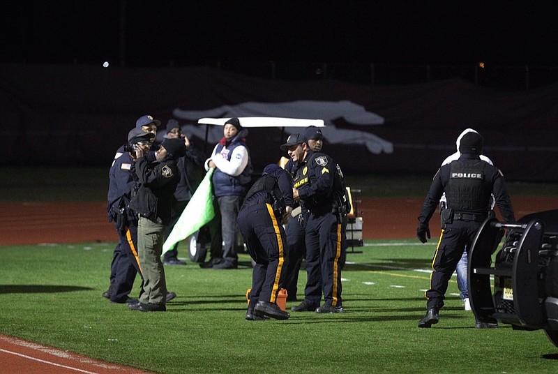 Police investigate the scene after a gunman shot into a crowd of people during a football game at Pleasantville High School in Pleasantville, N.J., Friday, Nov. 15, 2019. Players and spectators ran for cover Friday night when a gunman opened fire at the New Jersey high school football game. (Edward Lea/The Press of Atlantic City via AP)


