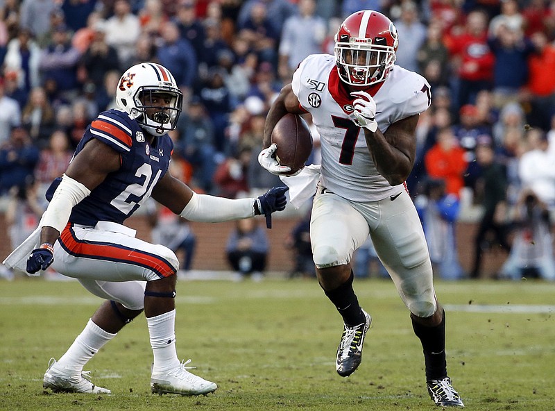 AP photo by Butch Dill / Georgia's D'Andre Swift rushed for 106 yards for an offense that had nine three-and-out possessions but three impressive touchdown drives during Saturday's 21-14 win at Auburn.