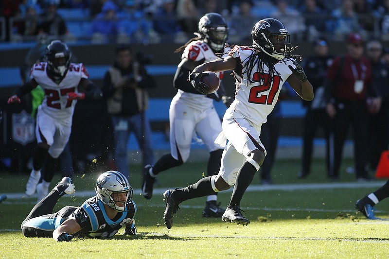 AP photo by Brian Blanco / Atlanta Falcons cornerback Desmond Trufant returns an interception with Carolina Panthers running back Christian McCaffrey on the ground after missing the tackle during the first half of Sunday's NFC South matchup in Charlotte, N.C.