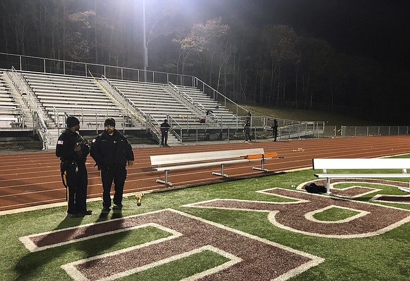 Police investigate the scene after a gunman shot into a crowd of people during a football game at Pleasantville High School in Pleasantville, N.J., Friday, Nov. 15, 2019. Players and spectators ran for cover Friday night when a gunman opened fire at the New Jersey high school football game. (Ahmad Austin/The Press of Atlantic City via AP)