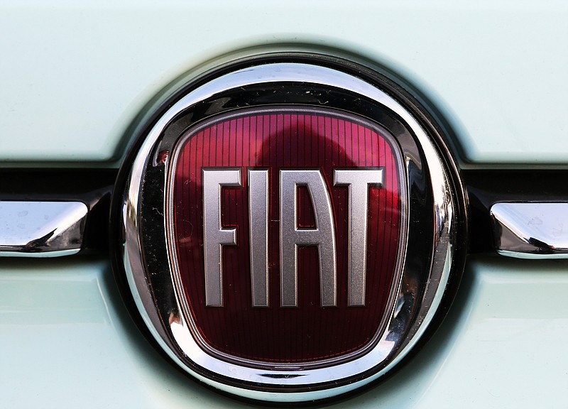 FILE - In this Oct. 31, 2019 file photo, a Fiat logo is pictured on a car in Bayonne, southwestern France. The United Auto Workers union has begun to focus bargaining on Fiat Chrysler, raising the possibility of another strike against a Detroit automaker. (AP Photo/Bob Edme, File)