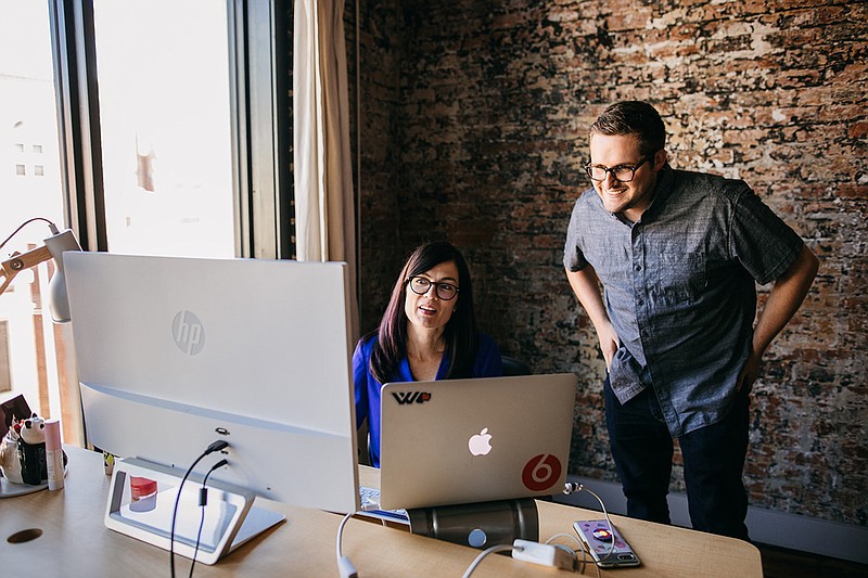 Contributed photography / Cindy Wincek and Max Farrell at the WorkHound offices.