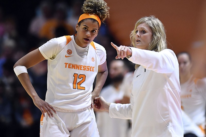In this Tuesday, Oct. 29, 2019, photo, Tennessee women's basketball coach Kellie Harper talks with Rae Burrell during the exhibition game against Carson-Newman in Knoxville, Tenn. Harper makes her debut Tuesday at East Tennessee State needing to stabilize a program that has lacked chemistry and consistency. (Saul Young/Knoxville News Sentinel via AP)