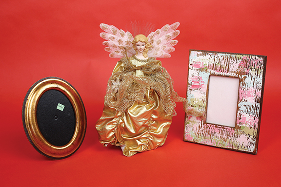 Staff photo by Erin O. Smith / Gold picture frame ($1.99), angel tree topper ($1.99), painted wooden picture frame ($1.99).