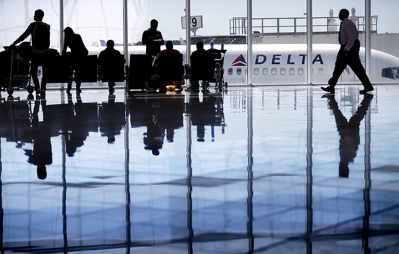 The Associated Press / In this Oct. 13, 2016, file photo, a Delta Air Lines jet sits at a gate at Hartsfield-Jackson Atlanta International Airport in Atlanta. 