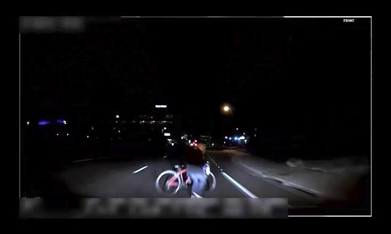 This file image made from video March 18, 2018, of a mounted camera provided by the Tempe Police Department shows an exterior view moments before an Uber SUV hit a woman in Tempe, Ariz. The chairman of the National Transportation Safety Board says Uber had an ineffective safety culture when one of its autonomous test vehicles ran down and killed a pedestrian last year in Tempe, Arizona. Robert Sumwalt said at a hearing Tuesday, Nov. 19, 2019, on the March 2018 crash that Uber didn't continually monitor its operations and it had de-activated its Volvo SUV's automatic emergency braking system. Uber's own system also didn't have the ability to brake automatically, relying on a human backup driver to do the braking. (Tempe Police Department via AP, File)