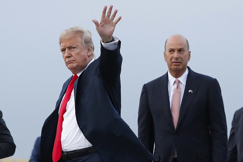 In this July 10, 2018, file photo, President Donald Trump is joined by Gordon Sondland, the U.S. ambassador to the European Union, second from right, as he arrives at Melsbroek Air Base, in Brussels, Belgium. Sondland originally planned to meet Tuesday, Nov 19, with EU Commission Vice President Valdis Dombrovskis to discuss better cooperation between the two trading juggernauts. That meeting was postponed indefinitely because Sondland was to testify Wednesday before Congress about his involvement in Ukraine. (AP Photo/Pablo Martinez Monsivais, File)