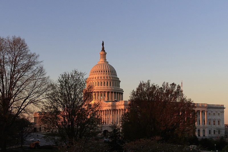 FILE - In this April 5, 2017, file photo, the Capitol is seen at sunrise in Washington.  At a time when many Americans say they're struggling to distinguish between fact and fiction, the country is broadly skeptical that facts underly some of the basic mechanisms of democracy in the United States - from political campaigns to voting choices to the policy decisions made by elected officials. (AP Photo/J. Scott Applewhite)
