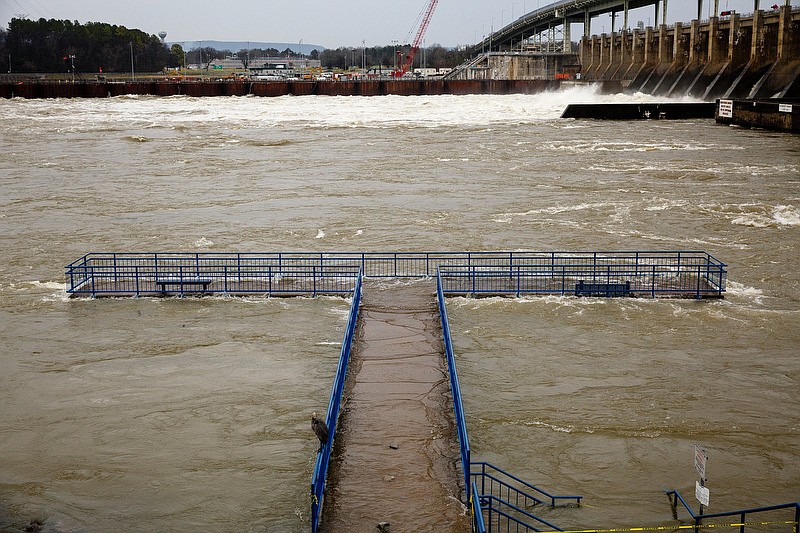 A Tennessee Riverpark pier is flooded as TVA spills water at the Chickamauga Dam on Wednesday, Jan. 2, 2019, in Chattanooga, Tenn. The Tennessee Valley Authority has declared 2018 the wettest year on record for the Tennessee Valley region with 67.1 inches of rainfall, surpassing a previous record of 65.1 inches set in 1973.