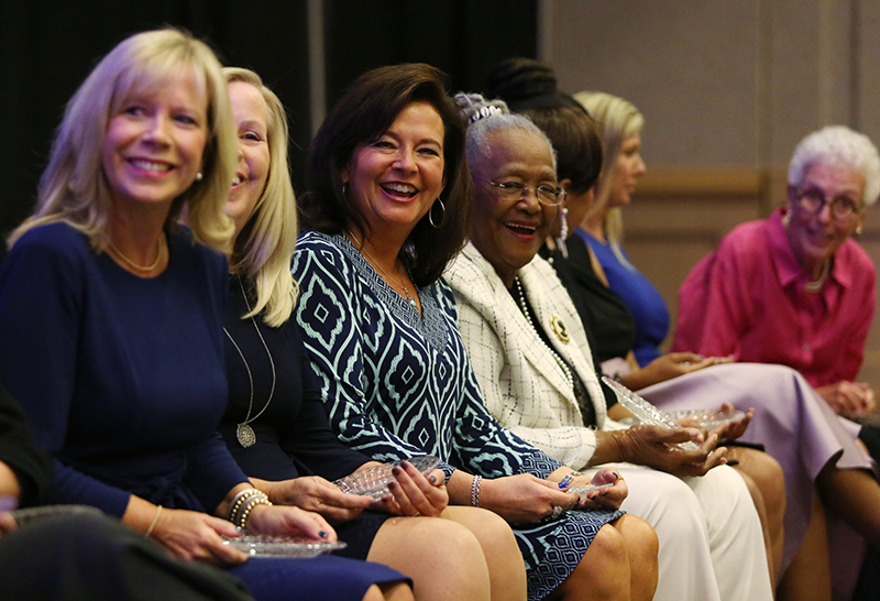 Staff photo by Erin O. Smith / The 2019 Women of Distinction listen to speakers during the program.