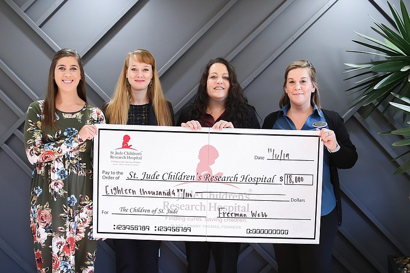 Contributed photo / Representatives from Freeman Webb recently presented an $18,000 check to St. Jude Children's Research Hospital. From left, are Chelsea Elliott, St. Jude regional development representative; Julie Maynor, Freeman Webb regional property manager; Lisa Arrington, Freeman Webb community manager; and Krishna Hennessee, Freeman Webb community manager.