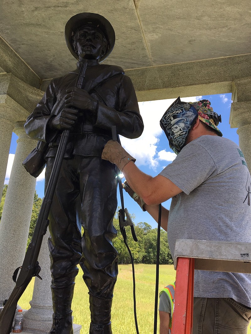 Photo Courtesy Of National Park Service / Workers fashion a new sword and scabbard for the Florida monument in the Chickamauga Battlefield.