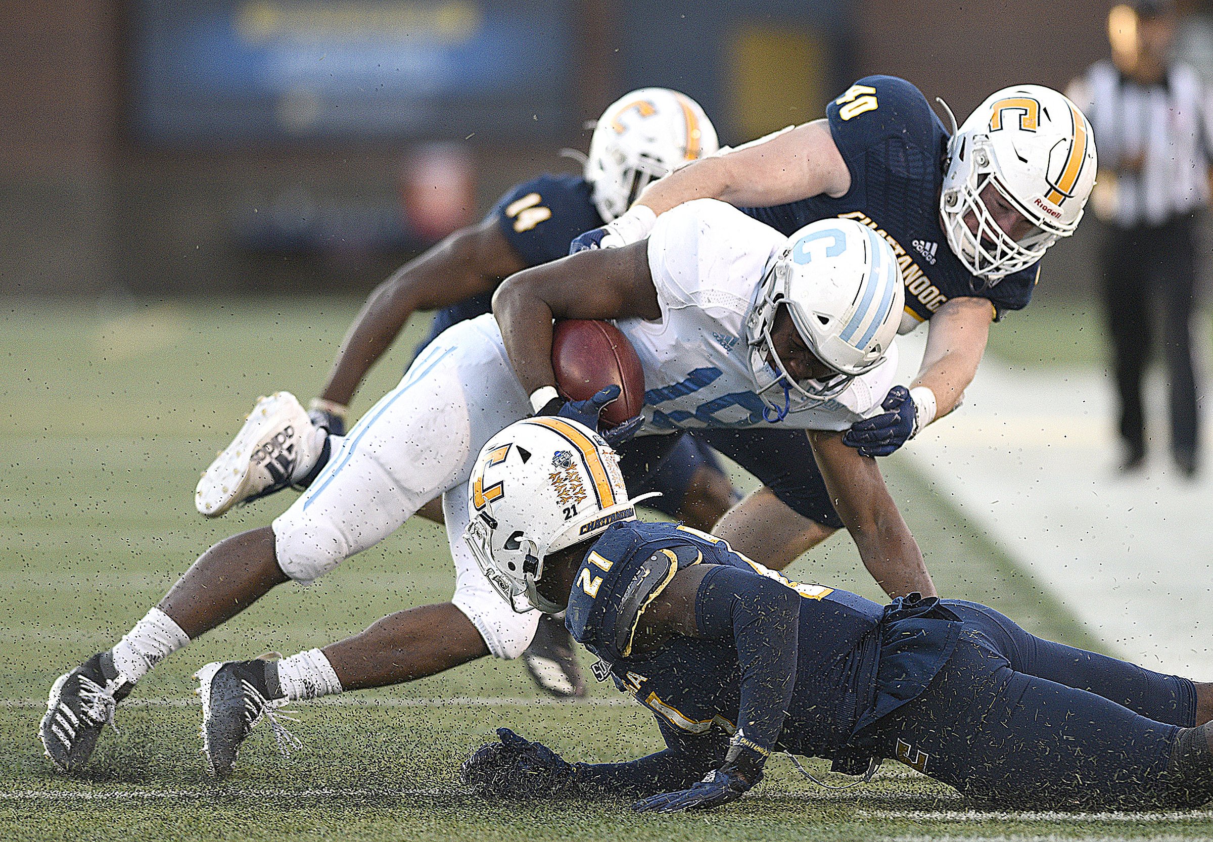 Staff photo by Robin Rudd / UTC linebacker Marshall Cooper, top, works with defensive back D.J. Jackson, bottom, to stop The Citadel's Dante Smith on a crucial third-down play during last Saturday's game at Finley Stadium, a 34-33 comeback victory for the Mocs. UTC, which closes the regular-season Saturday at VMI, still has a shot at sharing the SoCon title and receiving an at-large bid to the FCS postseason thanks to players such as Cooper, a former Hixson High School standout.
