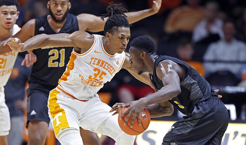 AP photo by Wade Payne / Alabama State guard Tobi Ewuosho dribbles while guarded by Tennessee's Yves Pons during Wednesday night's game in Knoxville.