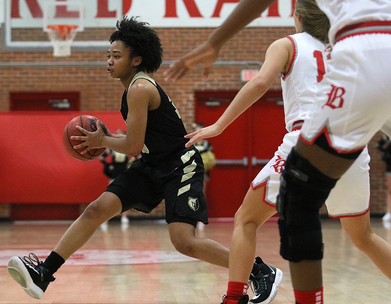Staff photo by Erin O. Smith / Bradley Central's Jamaryn Blair passes during Thursday night's game at Baylor. Blair played a big part in a late run for the Bearettes as they pulled away for a 60-47 victory.