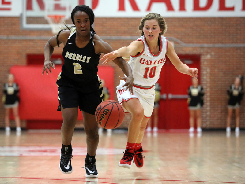 Staff photo by Erin O. Smith / Bradley Central's Jamia Williams (2) is fouled by Baylor's Britt Barton (10) as she dribbles the ball downcourt during the Baylor vs. Bradley Central girls' basketball game Thursday, November 21, 2019 at Baylor School in Chattanooga, Tennessee.