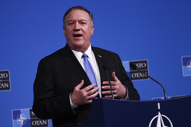 U.S. Secretary of State Mike Pompeo talks to journalists during a news conference during a NATO Foreign Ministers meeting at the NATO headquarters in Brussels, Wednesday, Nov. 20, 2019. (AP Photo/Francisco Seco)