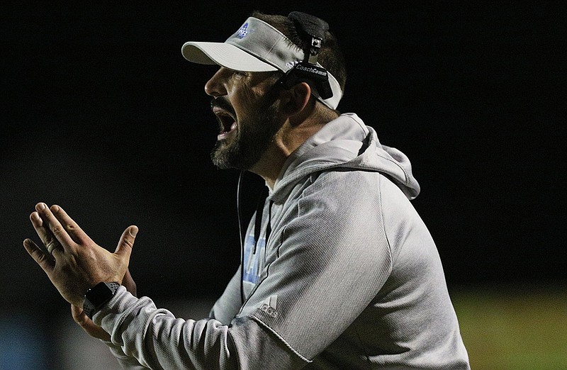 Staff photo by Erin O. Smith / Red Bank football coach Chris Brown calls a timeout during the Lions' home game against Loudon on Nov. 1.