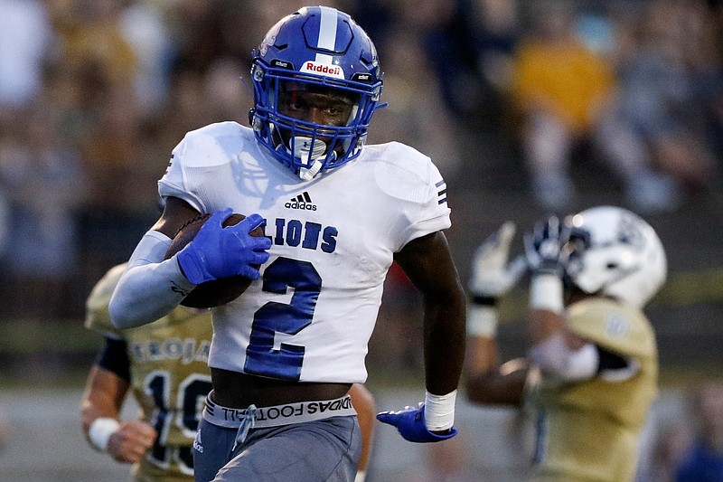 Staff photo by C.B. Schmelter / Red Bank's Lucas Brown heads to the end zone for a 50-yard touchdown catch on Aug. 23 at Soddy-Daisy. The visiting Lions won 38-7 in the season opener for both teams.