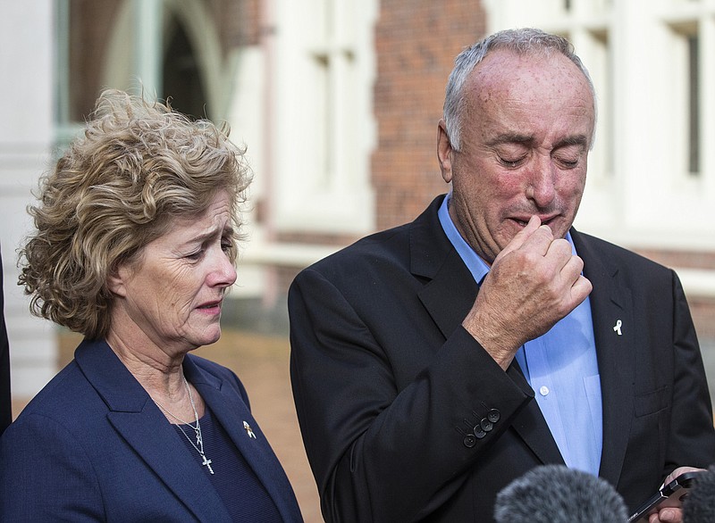 Parents of murdered British backpacker Grace Millane, Dave and Gillian react as they speak to the media outside the High Court, in Auckland, New Zealand, Friday, Nov. 22, 2019. A New Zealand jury found a man guilty of murder in the death of the 22-year-old British backpacker. (Jason Oxenham/New Zealand Herald via AP)
