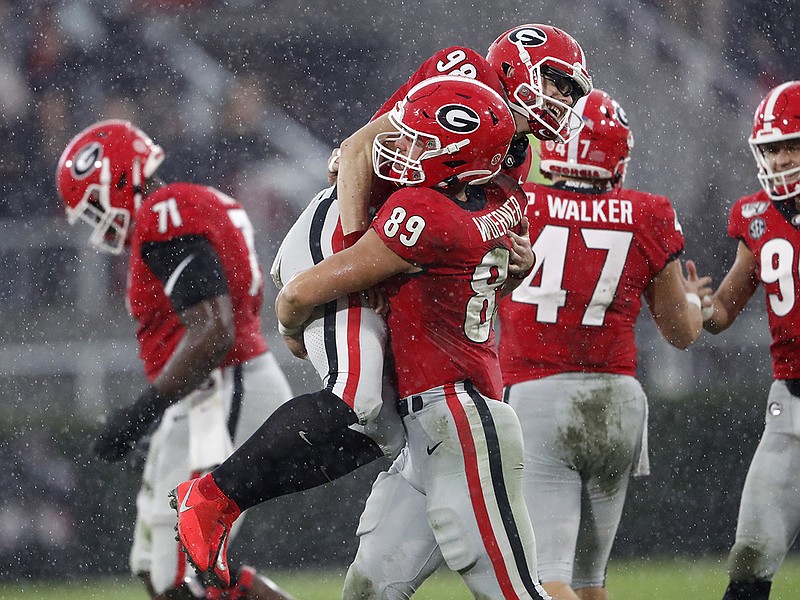 AP photo by John Bazemore / Georgia fifth-year senior kicker Rodrigo Blankenship gets a celebratory lift from Charlie Woerner after kicking a 49-yard field goal in the second quarter of Saturday's win over Texas A&M in Athens, Ga.