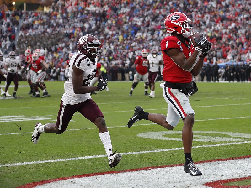 AP photo by John Bazemore / Georgia wide receiver George Pickens makes a 16-yard touchdown catch as Texas A&M defensive back Debione Renfro trails him during the second quarter of Saturday's game at Sanford Stadium. The Bulldogs went ahead 13-3 on the drive and won 19-13 to reach 10 wins for the season with at least three games to play.