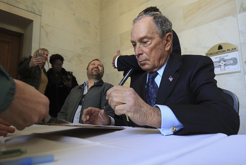 Former New York City Mayor Michael Bloomberg fills out paperwork, Tuesday, Nov. 12, 2019, at the state Capitol in Little Rock, Ark., to appear on the ballot in Arkansas' March 3 presidential primary. (Staton Breidenthal/The Arkansas Democrat-Gazette via AP)


