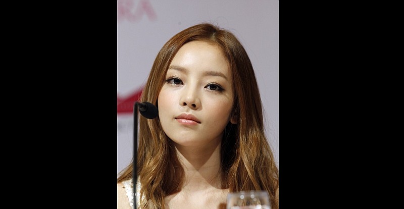 FILE - In this Tuesday, July 10, 2012 file photo, South Korea's pop girl group KARA's Goo Hara attends a press conference in Singapore. South Korean police say pop star Goo Hara has been found dead at her home in Seoul.Police say an acquaintance found the 28-year-old dead at her home in southern Seoul on Sunday, Nov. 24, 2019 and reported it to authorities. (AP Photo/Wong Maye-E, File)