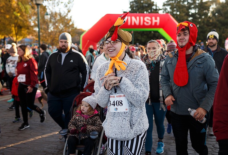 Staff File Photo / People walk in the Grateful Gobbler 5k at Coolidge Park on Thursday, Nov. 22, 2018, in Chattanooga, Tenn. The annual race benefits the Maclellan Shelter for Families.