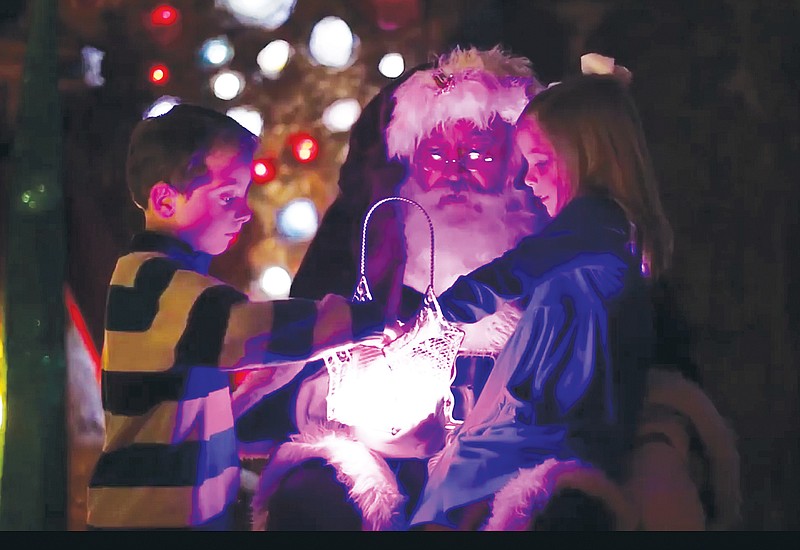 Photo by Matt Owens / Santa helps children mine geodes at Ruby Falls' Christmas Underground.