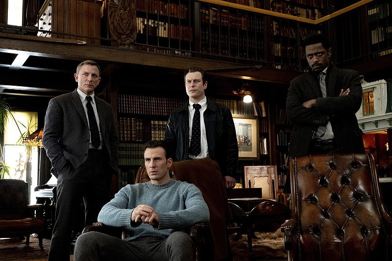 This image released by Lionsgate shows Daniel Craig, from left, Chris Evans, Noah Segan and Lakeith Stanfield in a scene from "Knives Out." (Claire Folger/Lionsgate via AP)