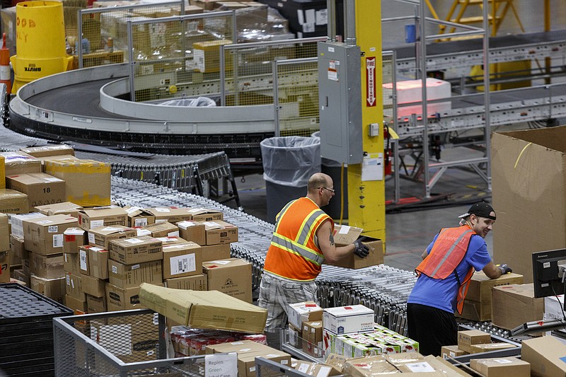 Staff photo by Doug Strickland / Workers unpack items shipped from affiliates to the Amazon Fulfillment Center in Enterprise South Industrial Park on Wednesday, Aug. 2, 2017, in Chattanooga, Tenn. Amazon held nationwide job fairs Wednesday to fill 50,000 positions as the company sees a surge in growth.