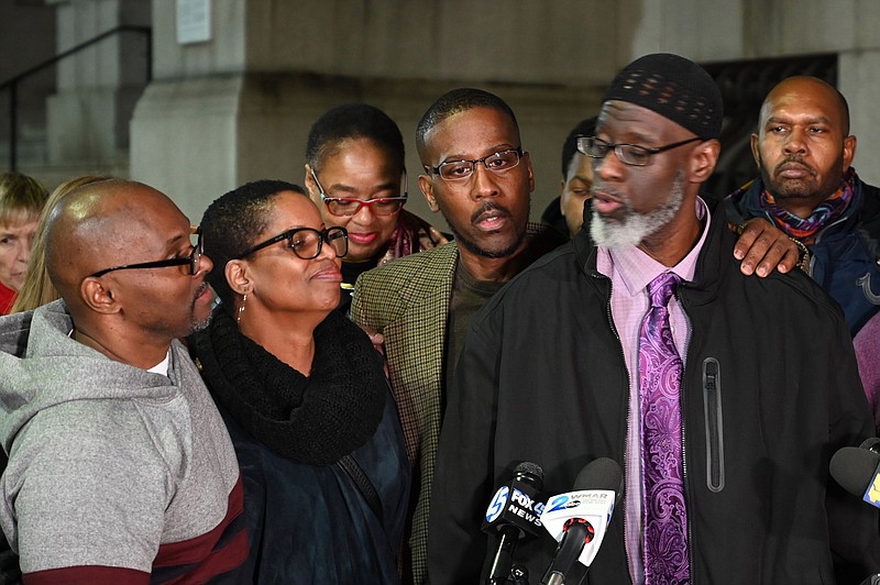 Andrew Stewart, from left, Alfred Chestnut, and Ransom Watkins speak Monday, Nov. 25, 2019, in Baltimore, Md. The three men had been incarcerated for 36 years in Maryland were exonerated Monday in the slaying of a Baltimore teenager after a review of their case. (Jerry Jackson/The Baltimore Sun via AP)