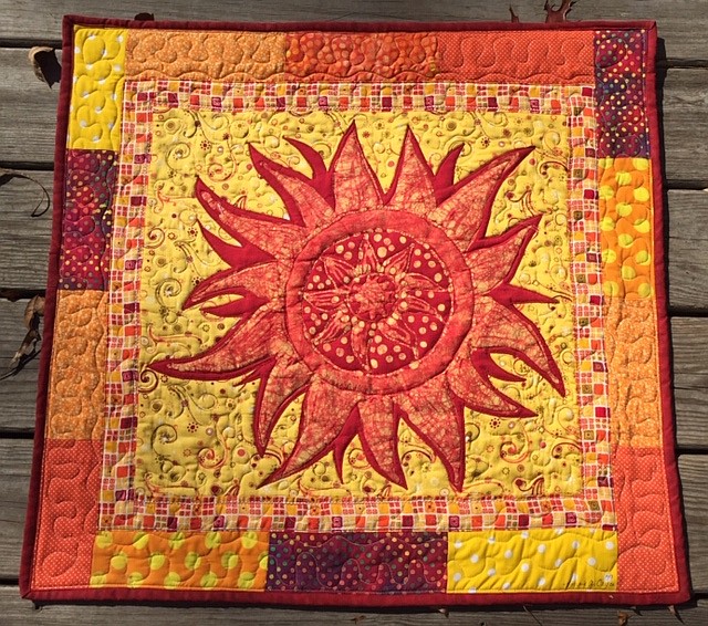 Photo from the artist / "Sunspots" textile by Bonnie Cayce.