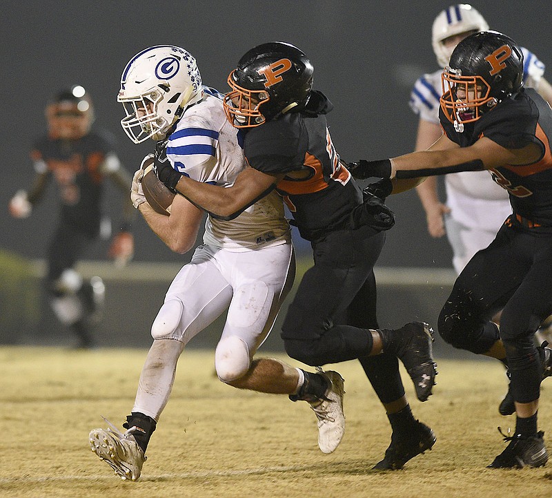 Staff Photo by Robin Rudd/  South Pittsburg's Javien Beene (20) drops Gordonsville Tyler Pemberton (16) for a loss.  The South Pittsburg Pirates hosted the Gordonsville Tigers in the quarter finials of the TSSAA Class A football championships on November 22, 2019.