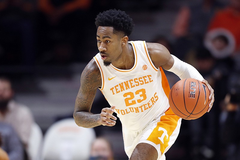 Tennessee guard Jordan Bowden (23) brings the ball up court during the second half of an NCAA college basketball game against Chattanooga Monday, Nov. 25, 2019, in Knoxville, Tenn. (AP Photo/Wade Payne)