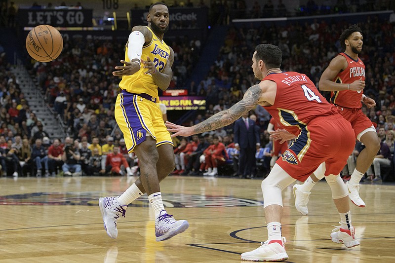 Los Angeles Lakers forward LeBron James (23) passes against the New Orleans Pelicans in the first half of an NBA basketball game in New Orleans, Wednesday, Nov. 27, 2019. (AP Photo/Matthew Hinton)