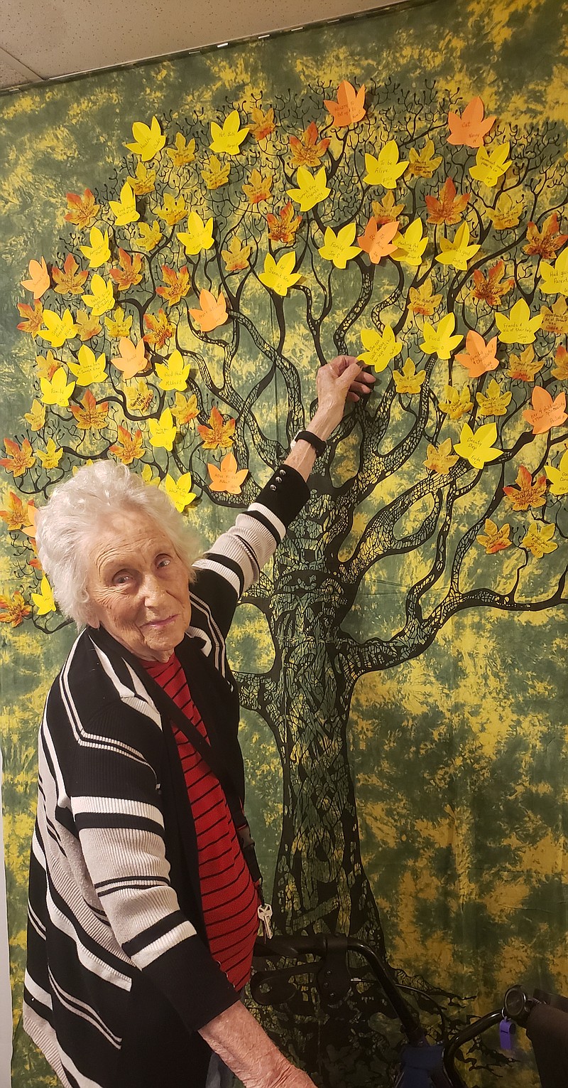 Contributed photo by Kendra Coulter / Gene Dillingham adds a leaf to the "Thankful Tree" at Summit View Senior Community off of Mountain Creek Road.