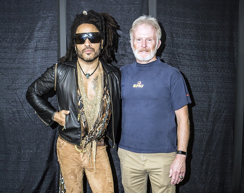 In this image provided by Mark Kelton, Lenny Kravitz, the headliner at this years Spookstock concert poses with Army Gen. Tony Thomas, former commander of U.S. Special Operations Command, at the annual Spookstock event, While many Washington insiders haven’t heard of it, the annual charitable event, held each year in an undisclosed Washington location, has become a centerpiece for Washington’s tight-knit intelligence-military special operations community. It has raised millions to fund higher education for the children of CIA field officers and special operations soldiers killed on duty. (Mark Kelton via AP)