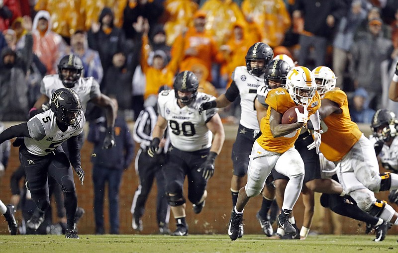 AP photo by Wade Payne / Tennessee running back Eric Gray leaves the Vanderbilt defense in his wake on the way to a 94-yard touchdown in the first half Saturday at Neyland Stadium.