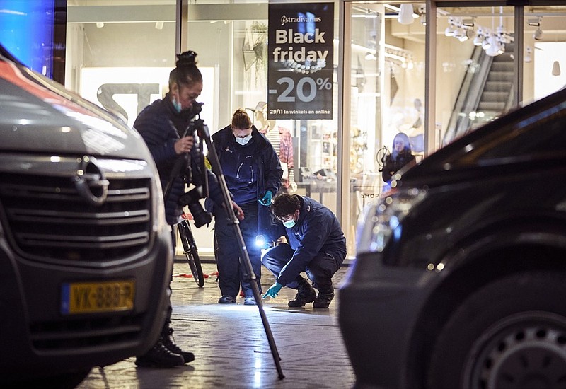 Forensic experts look for clues on the scene of a stabbing incident in the center of The Hague, Netherlands, Friday, Nov. 29, 2019. Dutch police say multiple people have been injured in a stabbing incident in The Hague's main shopping street. (AP Photo/Phil Nijhuis)


