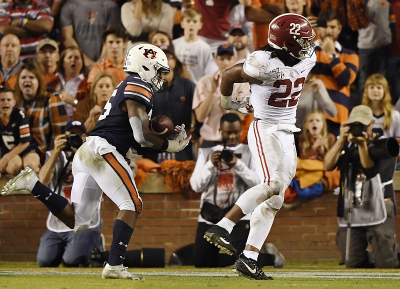 Auburn photo by Todd Van Emst / Alabama running back Najee Harris can't come up with a pass that Auburn's Zakoby McClain collects and returns 100 yards for a touchdown, helping propel the Tigers to a 48-45 upset Saturday at Jordan-Hare Stadium.