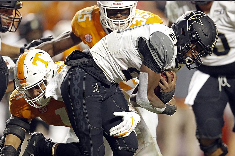 AP photo by Wade Payne / Tennessee linebacker Henry To'o To'o tries to wrap up Vanderbilt running back Keyon Brooks during the second half of Saturday's game in Knoxville.
