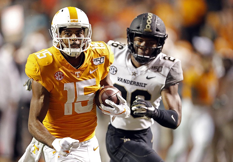 AP photo by Wade Payne / Tennessee wide receiver Jauan Jennings outruns Vanderbilt safety Anfernee Orji in the second half of Saturday's SEC East matchup in Knoxville.