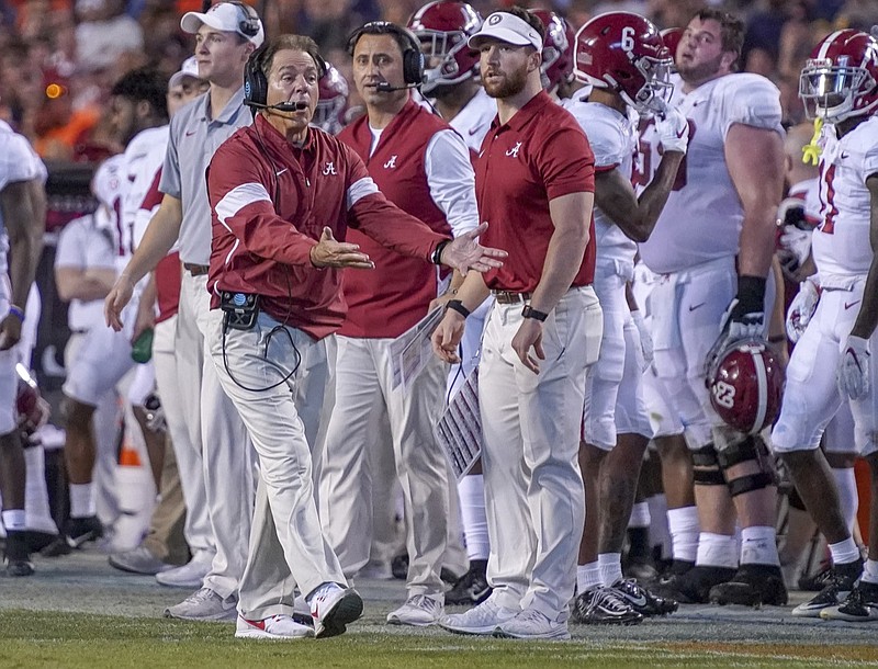 Alabama head coach Nick Saban disagrees with a call in the second half of an NCAA college football game against Auburn in Auburn, Ala., on Saturday, Nov. 30, 2019. (Chris Shimek/The Decatur Daily via AP)