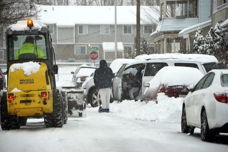 A vehicle is stuck in the snow on Murray Hill Avenue in Springfield's Liberty Heights neighborhood after an overnight snowstorm, Monday, Dec. 2, 2019, in Springfield, Mass. (Don Treeger/The Republican via AP)

