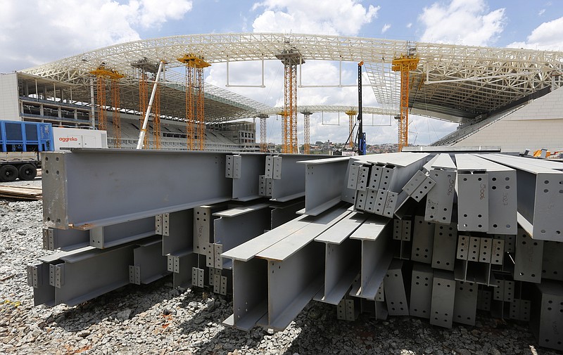 FILE - In this Dec. 8, 2013 file photo, steel beams sit outside Arena de Sao Paulo in Sao Paulo, Brazil. President Donald Trump on Dec. 2, 2019 accused Brazil and Argentina of hurting American farmers through currency manipulation and said he'll slap tariffs on their steel and aluminum imports to retaliate. (AP Photo/Ferdinand Ostrop, File)