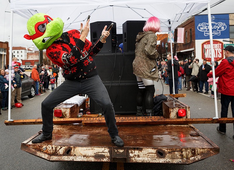 Staff File Photo / A person dressed as a Teenage Mutant Ninja Turtle dances on a float during the 2018 Mainx24 festival's parade. The parade down Main Street is scheduled to step off Saturday at 10:30 a.m.